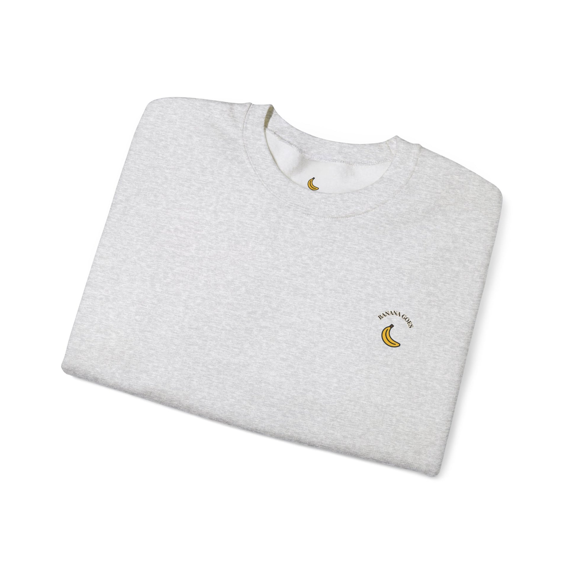 Folded gray sweatshirt with a small logo on a white background