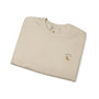 Folded beige t-shirt with a small logo on a white background