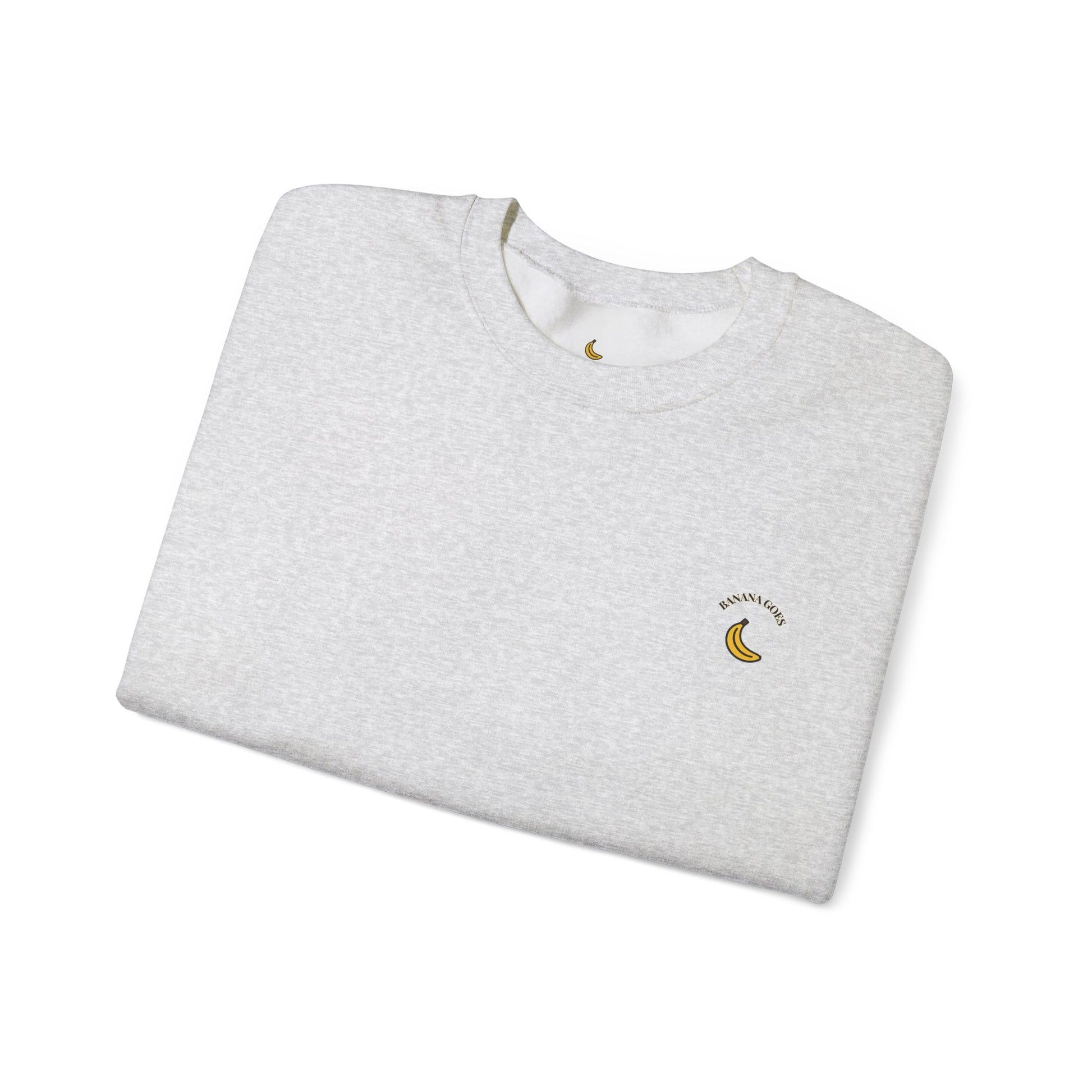 Folded gray sweatshirt with a small logo on a white background