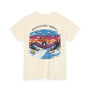 Beige t-shirt with a colorful graphic of a skier and mountain scene on a white background